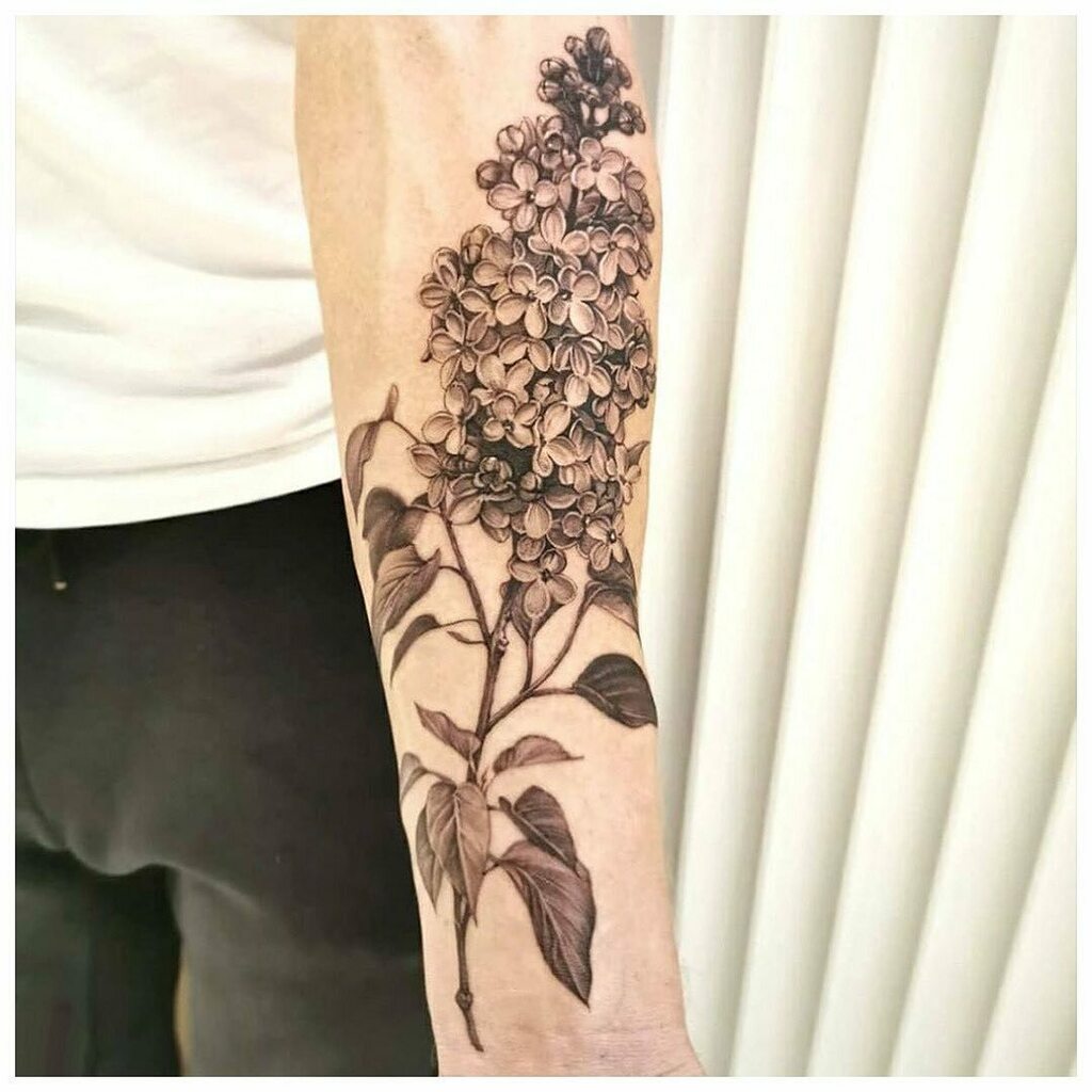 Lilac flower tattoo located on the inner forearm,