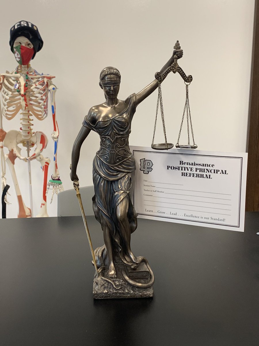 Lady Justice is promoting the positive referral program at our school.  She is very excited to show the evidence!