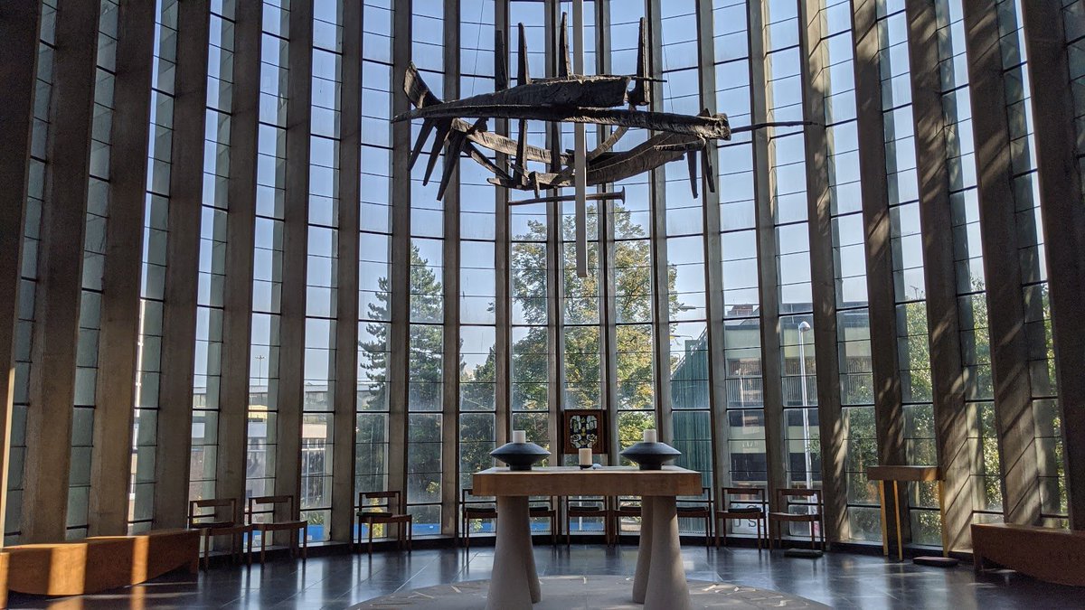 If you pass that chapel, turning right, you come to the Chapel of Christ the Servant - all windows and light. With a gorgeous piece of artwork suspended above the modest altar.