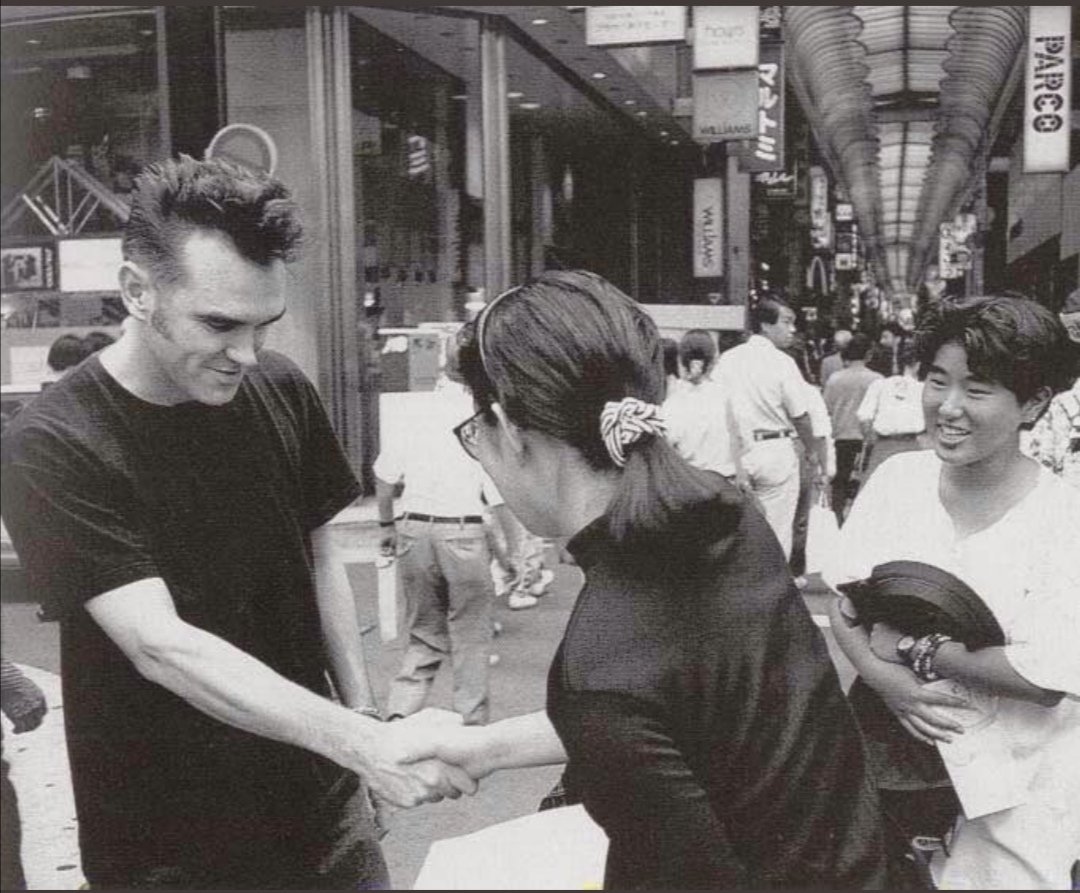 maladylingerson's tweet photo. pictures of morrissey looking very awkward around other people are some of my favourite things https://t.co/bqzgu2OJKG