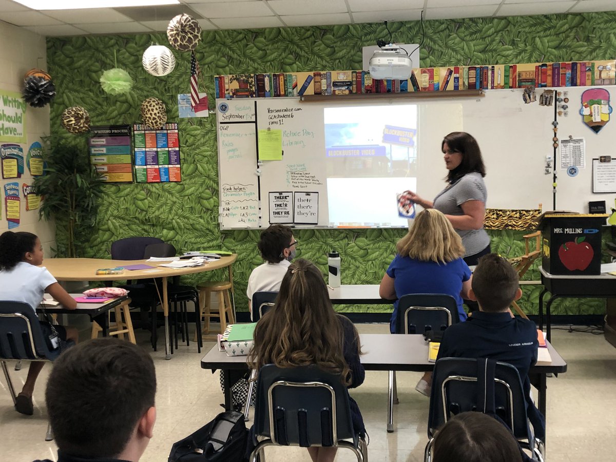 gcaearlymiddle's tweet photo. 6th grade students began a new novel study today in which the main character loves to go to video stores. Mrs. Mullins took time to explain what a video store is to students who have never seen one. https://t.co/0k8bPQgAlK