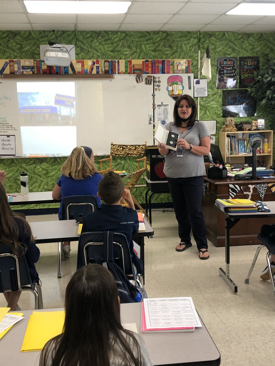 gcaearlymiddle's tweet photo. 6th grade students began a new novel study today in which the main character loves to go to video stores. Mrs. Mullins took time to explain what a video store is to students who have never seen one. https://t.co/0k8bPQgAlK