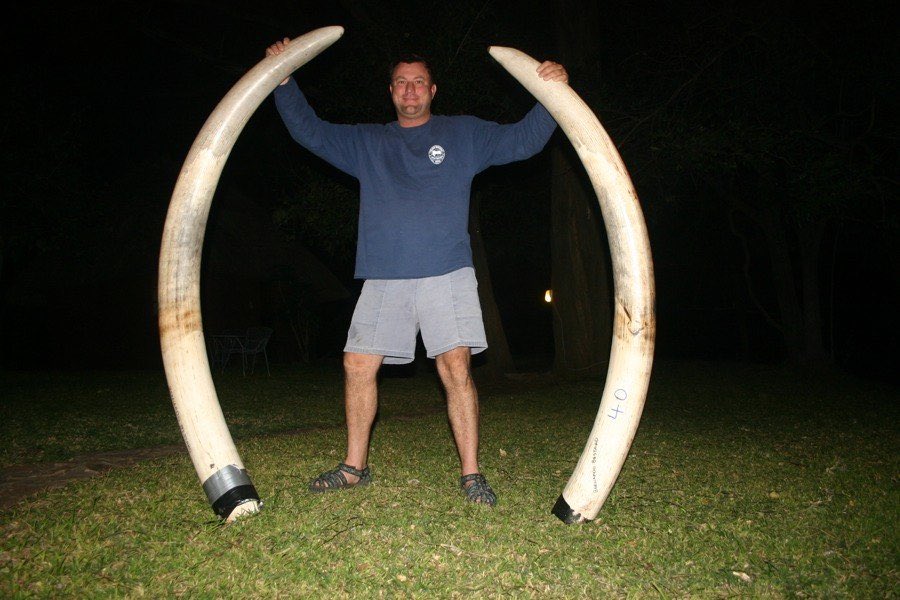 Theunis Botha, a hunter known for killing leopards using hounds, died in Zimbabwe when a shot elephant fell on top of him. Thank you Karma!