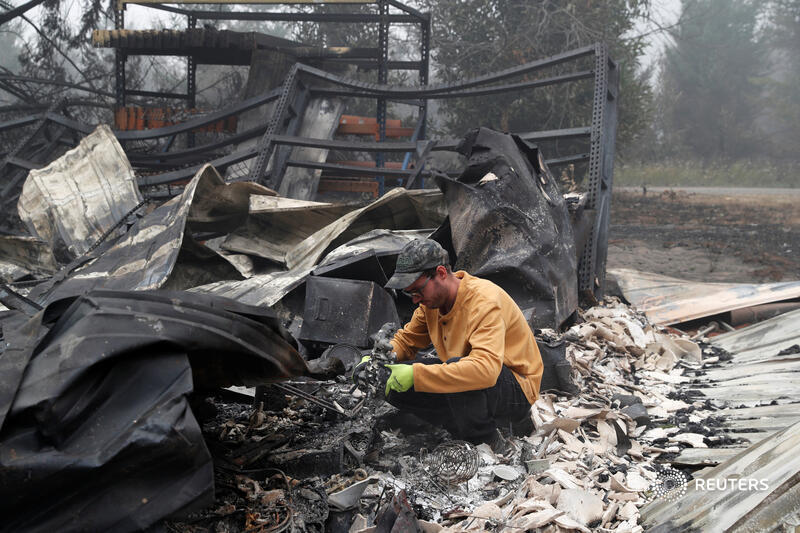 Reuters's tweet photo. 'All gone:' Residents return to burned-out Oregon towns as many West Coast wildfires keep burning https://t.co/NkclJ2Iggy https://t.co/NDQS3otnZM