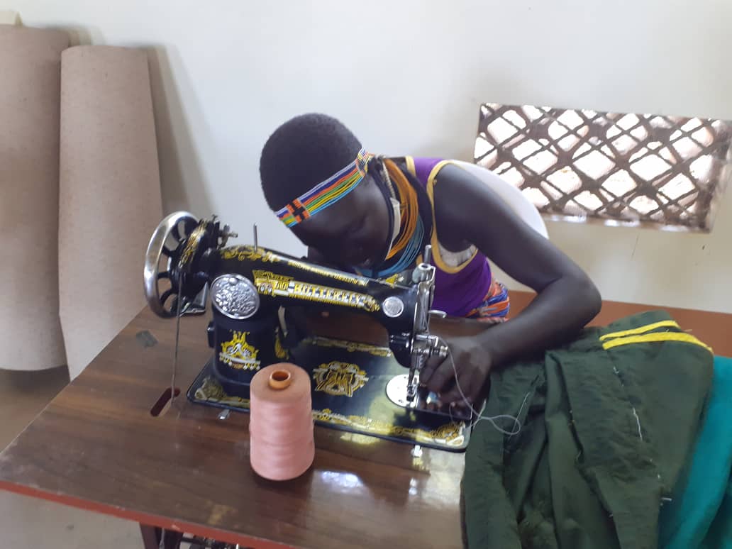 UNinUganda's tweet photo. UN Resident Coordinator @RMalango2015 with #UNUgKaramojaMission are visiting Katikekile Youth Group in Moroto involved in tailoring, soap making, weaving and craft making from enterprise development assistance #1MillionSDGSolutions https://t.co/6fBcS8ndGJ