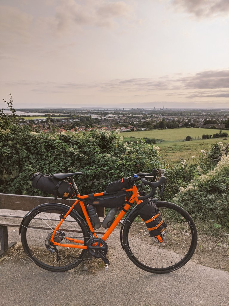 nikcorg's tweet photo. To protect the paint on my @MASON_Cycles #MasonBokeh from bag rub, I upcycled an old inner tube, wrapping it around the top tube. Now my bags moving during out-of-the-saddle efforts won't chafe the lacquer and no need for helicopter tape.
#BikeHacks #BikePacking #FarFast https://t.co/RYzwMGXDCo
