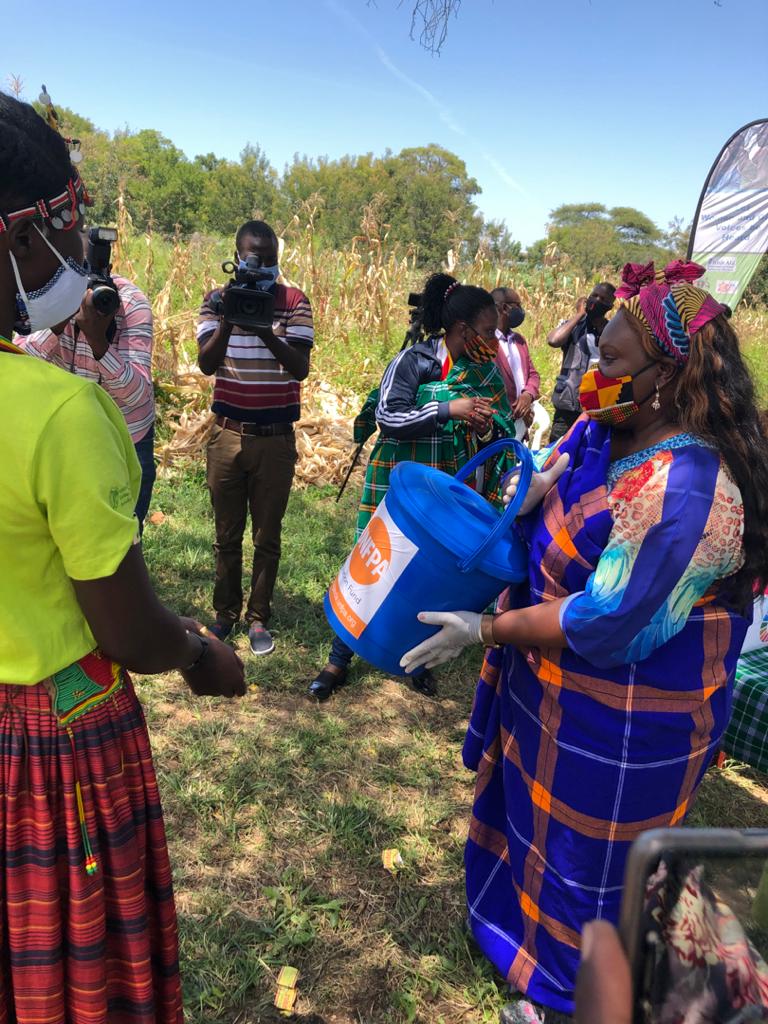 UNinUganda's tweet photo. Katikekile Youth Group members in Moroto welcome UN Resident Coordinator @RMalango2015 and #UNUgKaramojaMission The group showcased their work including tailoring & crafts #1MillionSDGSolutions https://t.co/M9MF2rYiym