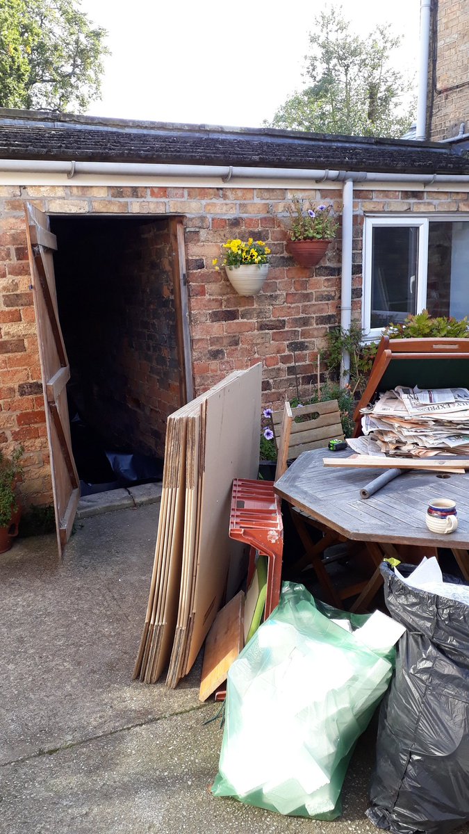 Putting a floor on an old shed to store packaging materials.