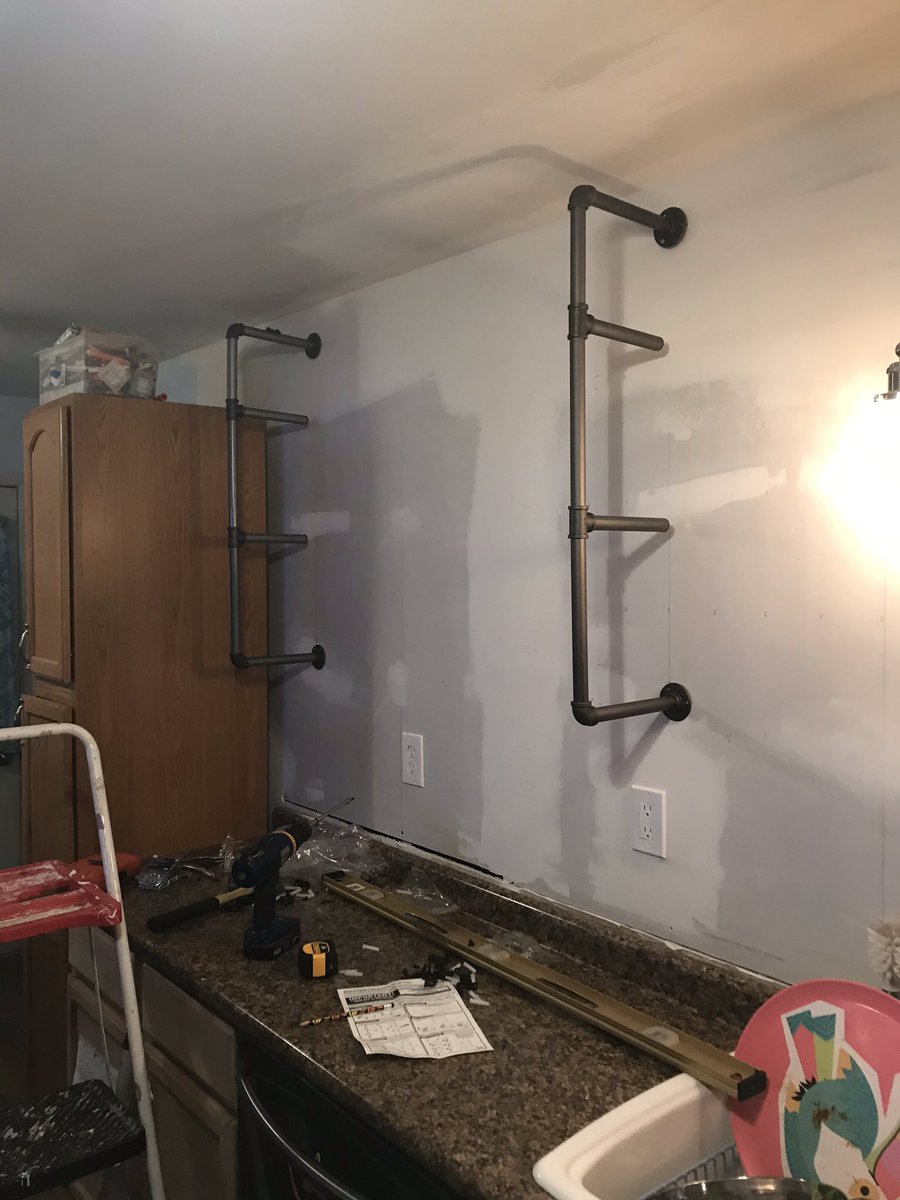 Putting up shelves, pretty easy right, instructions have different length pipes than provided .... now throw in uneven ceilings = going cross-eyed for the win