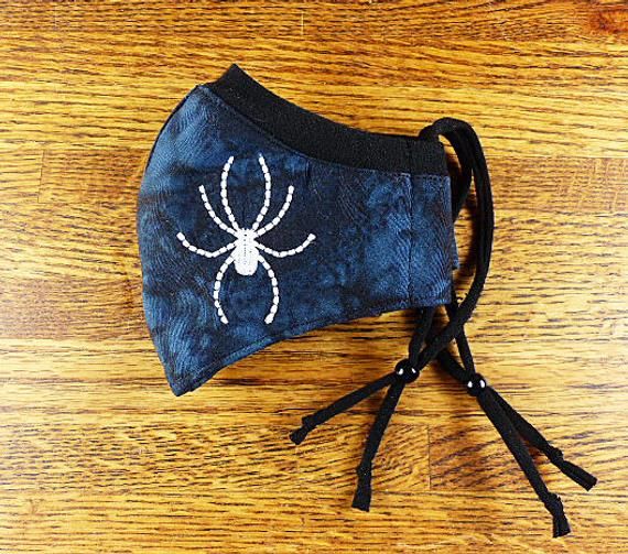 SantaFeKiss's tweet photo. Spider Embroidered on Washable, 3 layer face mask w Stretchy nose band to help eliminate fogging of glasses w Filter pocket / Handcrafted in the USA #funfacemask #facemask https://t.co/z79u9nDPj6 via @Etsy https://t.co/9xTALkz3se
