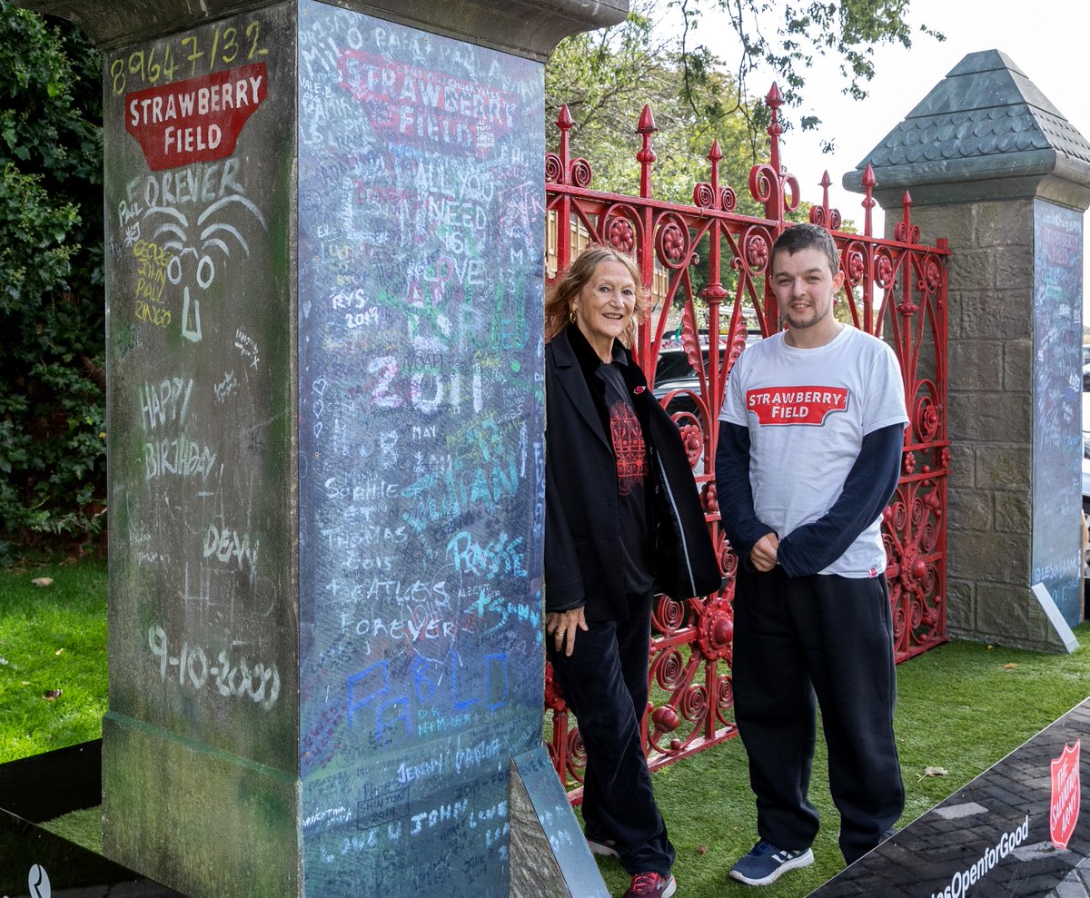strawberryfield's tweet photo. Just before we opened last year, our iconic red gates returned home. They had spent some time away from site, but now they're situated in our gardens for all to see. Julia and one of our Steps to Work trainees, Mike are pictured with the gates as they arrived #StrawberryFieldOne https://t.co/9IpX6DVCRk