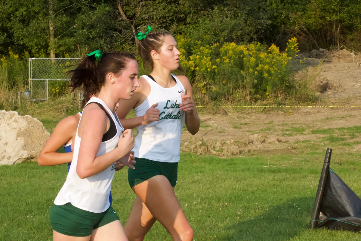 LakeTrackXC's tweet photo. Congrats to freshman Kelly Ward for winning the inaugural Catholic Cat Classic, our dual meet against NDCL! Mila Udovicic finished second for a strong 1-2 showing for LCXC. https://t.co/pm381hVpmB