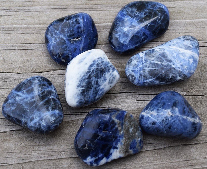 sodalite - blue/black with white banding- aids in strengthening ones natural intuition and trusting one own’s judgement - helps w verbalization of feelings & self-expression- brings emotional balance & tranquility - gives clarity regarding visions or intuitive messages