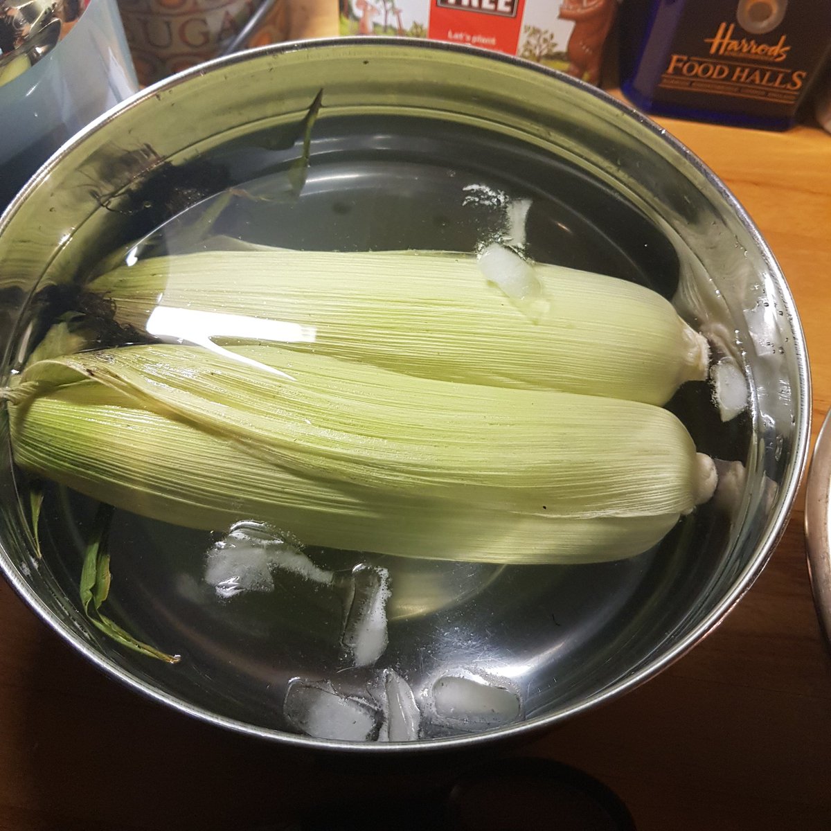 Got to have some corn on the cob with a BBQ. Best way, and to try and minimise waste through using tin foil, we're cooking it with the husks on. Step one though is soaking it in ice cold water to give it some moisture.