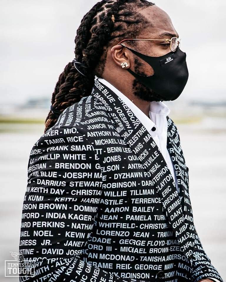 clarencehilljr's tweet photo. Derick Henry, star running back for the Tennessee Titans, touched down for today's game wearing a suit with the names of African Americans killed by police https://t.co/AaqYty1R1E