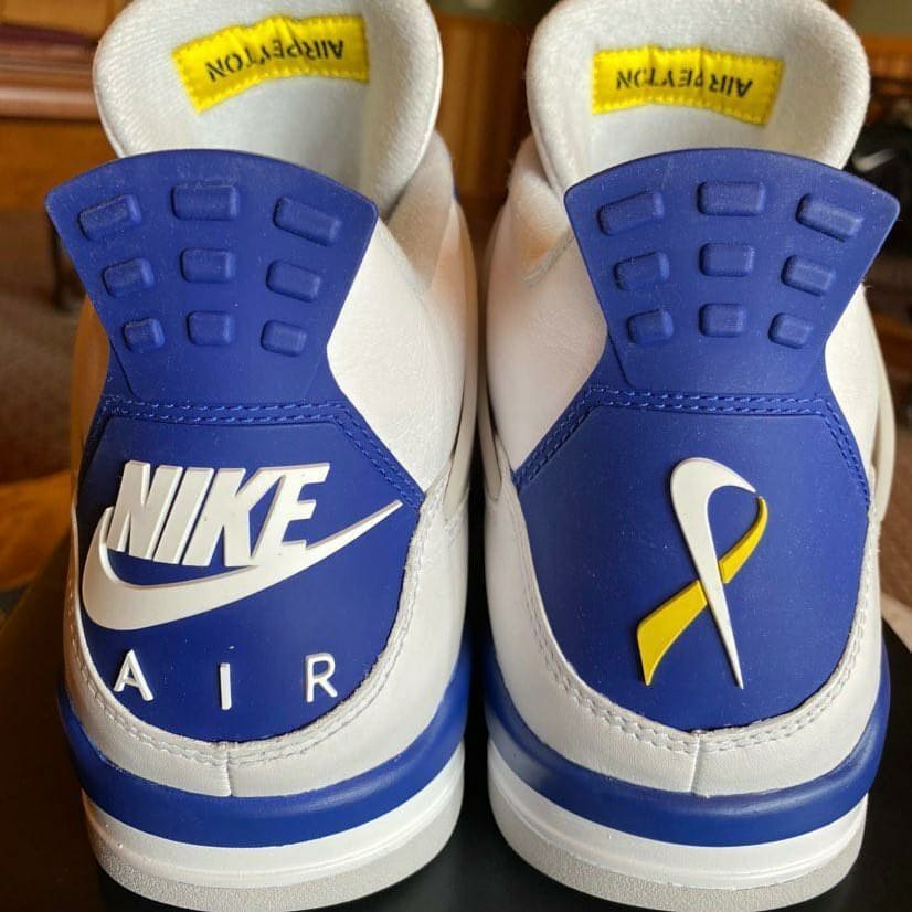 saint's tweet photo. Air Jordan 4 "Make-A-Wish"🎗️💙

-Designed by cancer survivor Peyton Smith
-Only 4 pairs made
-Highlighted by the Nike Cancer Ribbon on the heel and "Air Peyton" behind the tongue https://t.co/4XfkaoYpMM