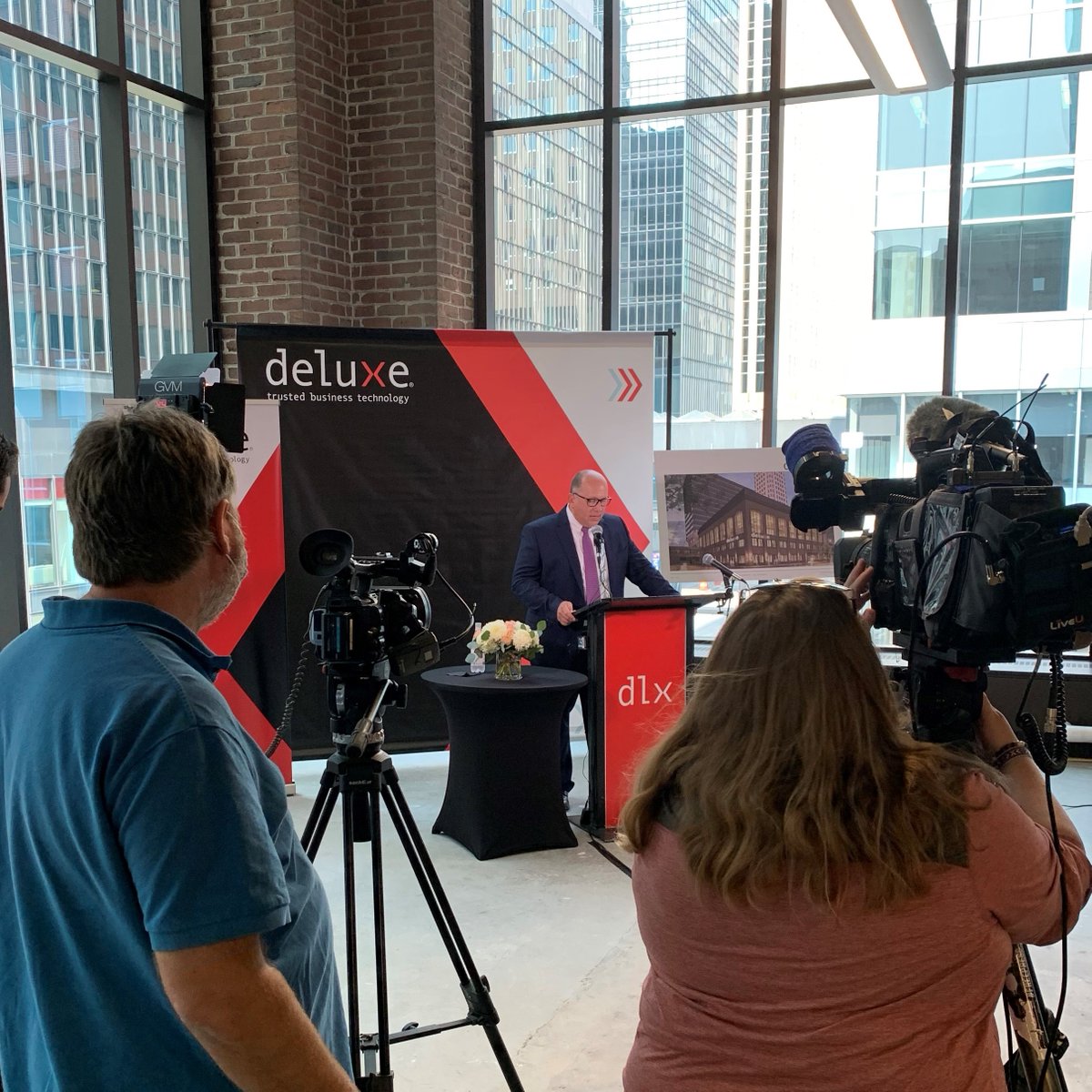 Deluxe's tweet photo. This afternoon, we announced we are moving our headquarters to downtown Minneapolis. Pres. &amp; CEO @BarryDeluxeCorp, @GovTimWalz, Mayor @Jacob_Frey and others spoke at a news conference about what the move means for the city, the state and Deluxe itself. https://t.co/sK5J63i2bH