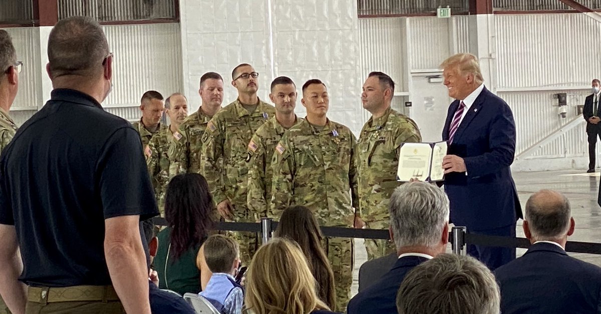Scavino45's tweet photo. POTUS @realDonaldTrump, at Sacramento McClellan Airport in California where he was briefed on the CA wildfires, and where he awarded the Distinguished Flying Cross to brave pilots &amp; crew members of the CA Army National Guard. Read their harrowing mission: https://t.co/v6RflgYWUZ https://t.co/D6agZlQDaZ