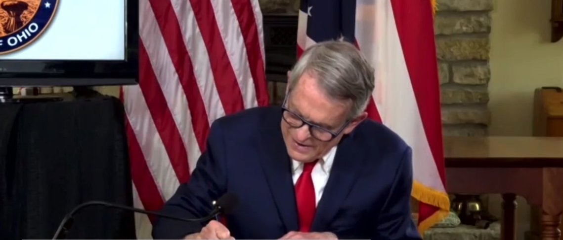 GovMikeDeWine's tweet photo. Today I signed House Bill 606, which ensures civil immunity to individuals, schools, health care providers, businesses, and other entities from lawsuits arising from exposure, transmission, or contraction of COVID-19. https://t.co/QH1cwDJIW2