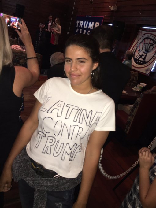 _SJPeace_'s tweet photo. Since Latinos for trump is trending 

Can't forget this iconic moment 

She went to protest a Trump rally wearing a shirt that said "Latinas AGAINST trump" and Eric Trump and his wife took a picture with her thinking she was a supporter. 🤣😂😭 https://t.co/Jn58R1lOvi