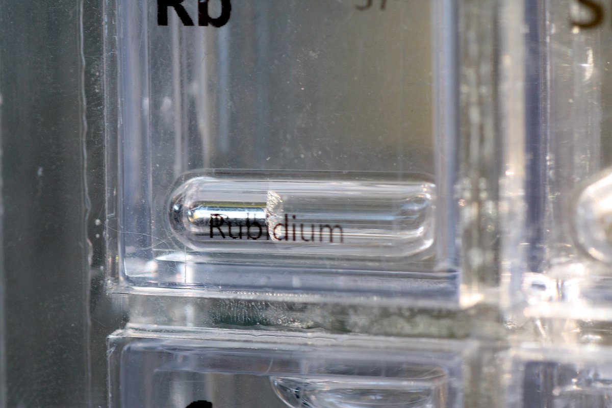 Rubidium  #elementphotos. True colour is silver-grey, but seems to take on a bronze colour in the smaller ampoules, perhaps in the sealing process. Rb melting point is just 39 °C. White compound is rubidium chloride (RbCl).