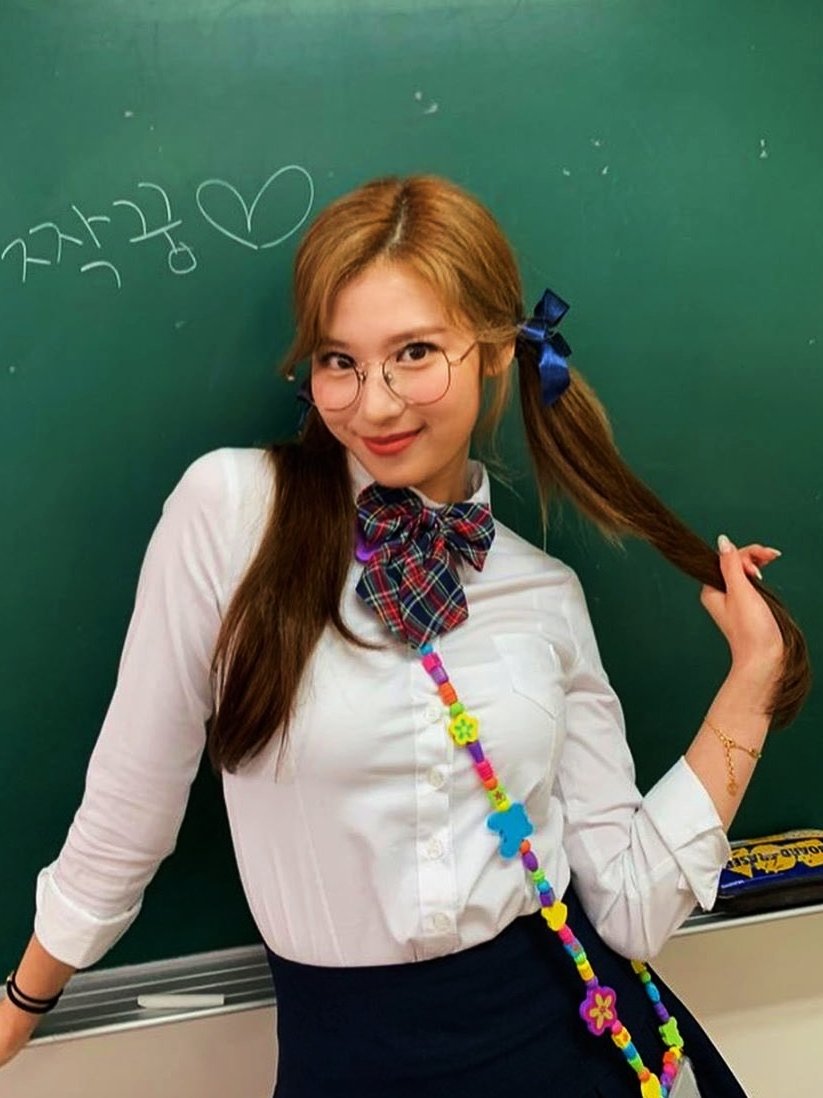 Image of School girl with scarf and belt