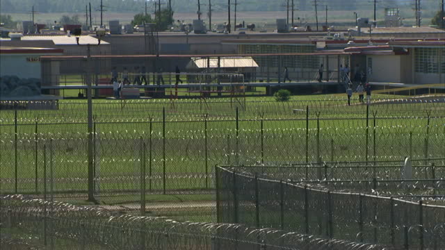 The camp is protected by fences and barbed wire, preventing any escapes. Watch towers looming over the scene  #Xinjiang