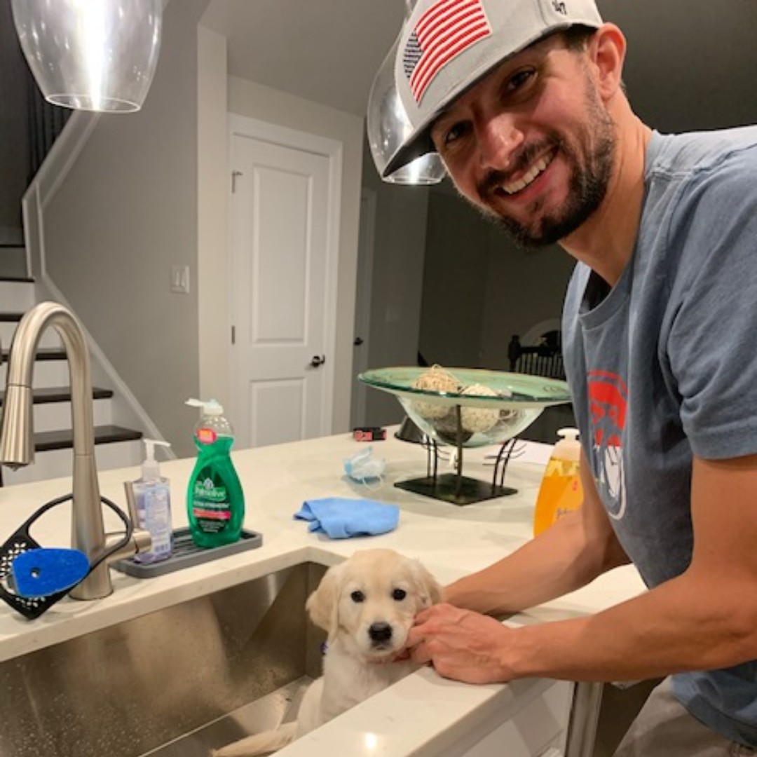 SupportOHT's tweet photo. Our OHT social media guy got a new puppy named Minnie! During Minnie’s first bath in her new home, her daddy was wearing his favorite OHT hat. #OHTDogs https://t.co/AZZehqmsMs