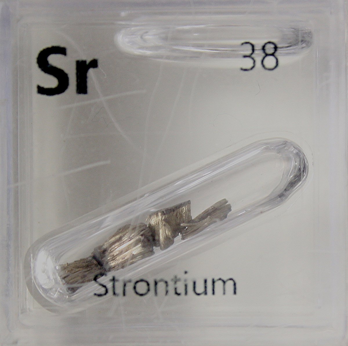 Strontium  #elementphotos. Pale blue crystal is celestite, SrSO4.