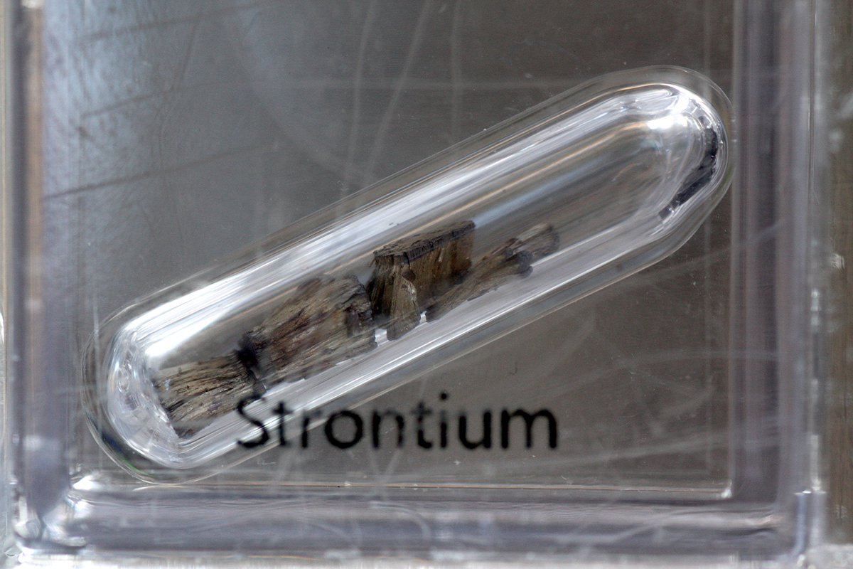 Strontium  #elementphotos. Pale blue crystal is celestite, SrSO4.