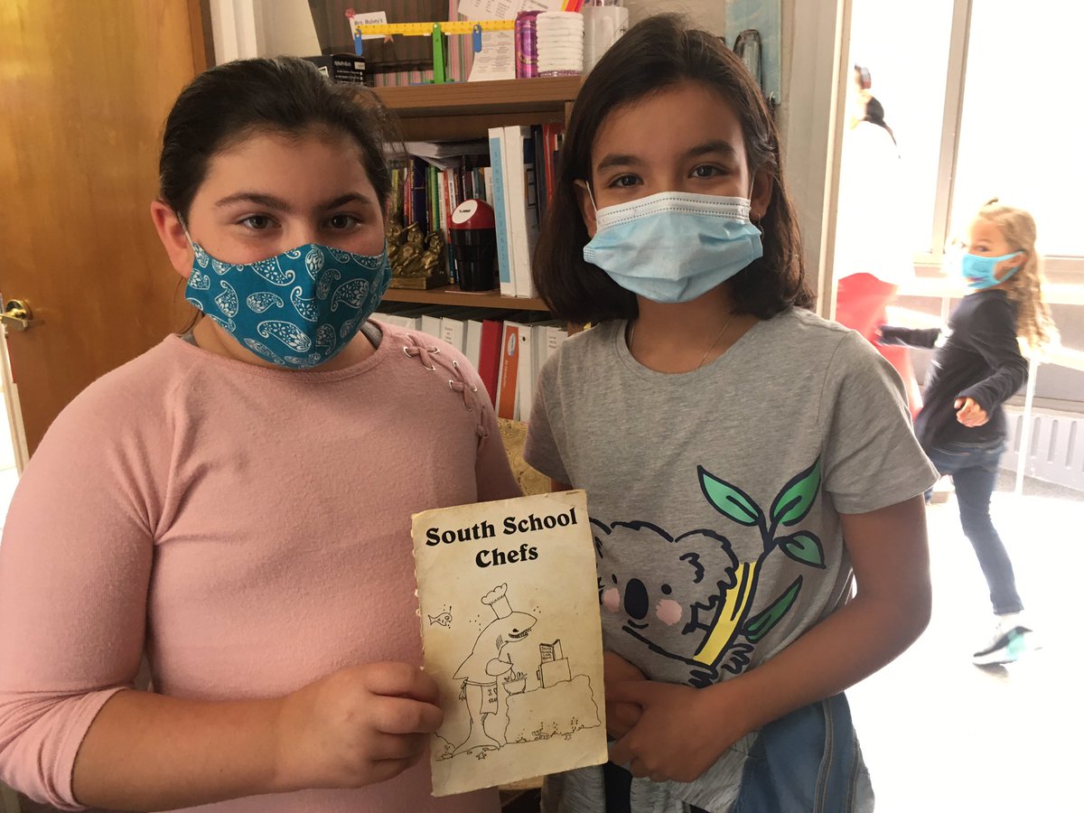Fifth graders share an artifact from 1990s - the cover of a PTO cookbook from when Dad attended the South!