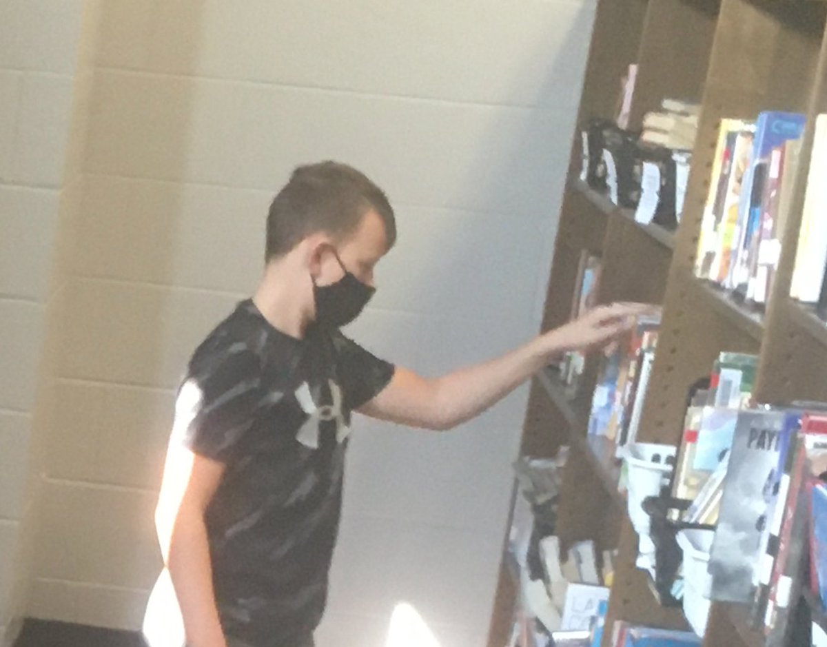 6th grade students who finished their homework before study hall are volunteering in the library by helping re-barcode books that won't scan correctly. Much appreciated! #JCSDpride