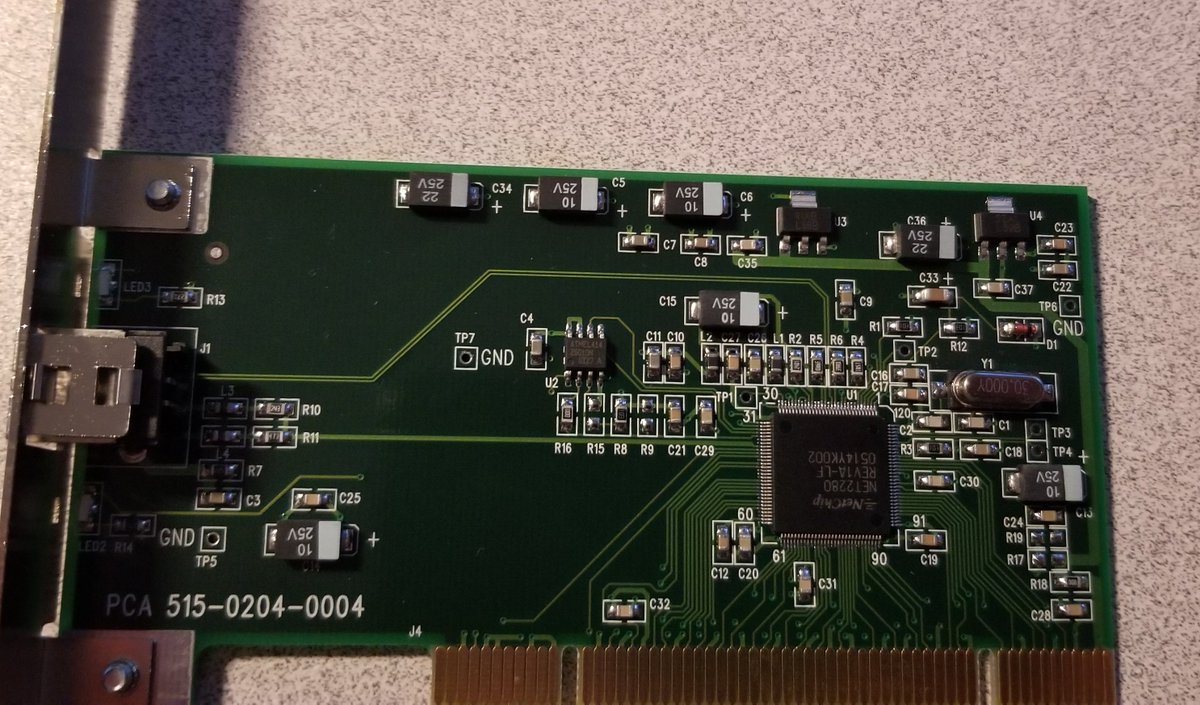 Looking at the board, it's pretty simple. It's a single big chip, a small chip, and some support circuitry.