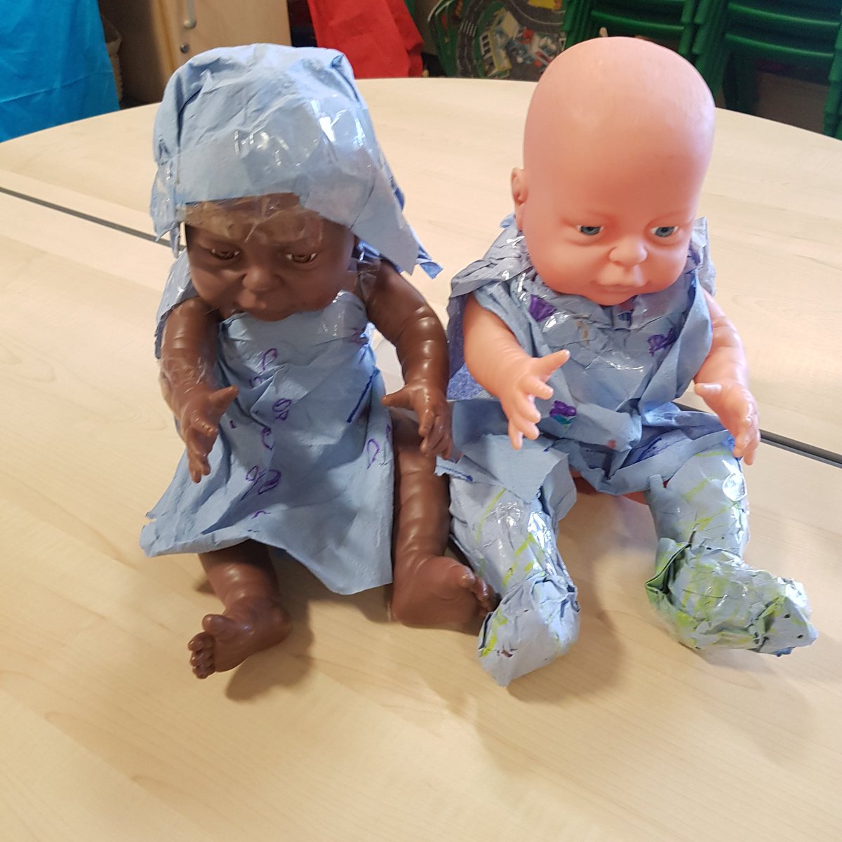 InshesP1's tweet photo. The babies had no clothes to wear after their bath. A few paper towels, sticky tape and colourful designs later they both had these ensembles to wear!P1 work completely.The socks are so impressive!🧦🤩 #ScottishStyle  #FutureFashionDesigners https://t.co/Jzvgp4Ez55