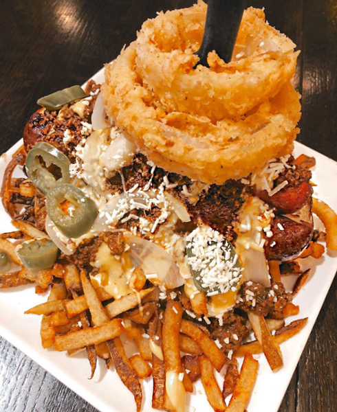 Kick off Labor Day weekend with our kobe dog in an artisan bun and topped with 6-pepper chili, cotija cheese, pickled jalapeños, and a tower of fried onion ring. Available at our Washington Ave. location. Visit qoo.ly/37ynnm to view our menu!