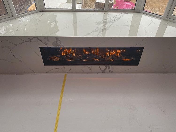 Evonicfires's tweet photo. Just wow ππ₯π Check this out from @sktiling Our e1500gf expertly installed into a window bench with marble surround. Never seen this type of install before, but it certainly looks impressive π @evonicfires #fireplacesurround #fire #marblesurfaces #fresh #style #interiordesign https://t.co/wKi5NmsVuS