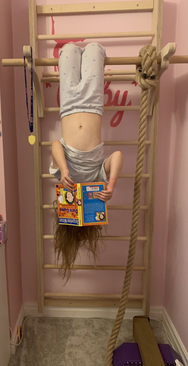 emzj's tweet photo. Ruby spends half her life upside down so no surprises that this is how she chooses to read her books! @Broadoak_Year3 @Broadoak_Year4 https://t.co/CiYfm5DZoN