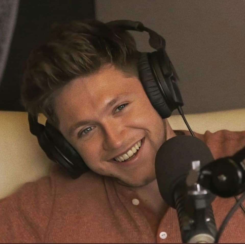 Again wearing headphones during various radio interviews...that smile is still there 