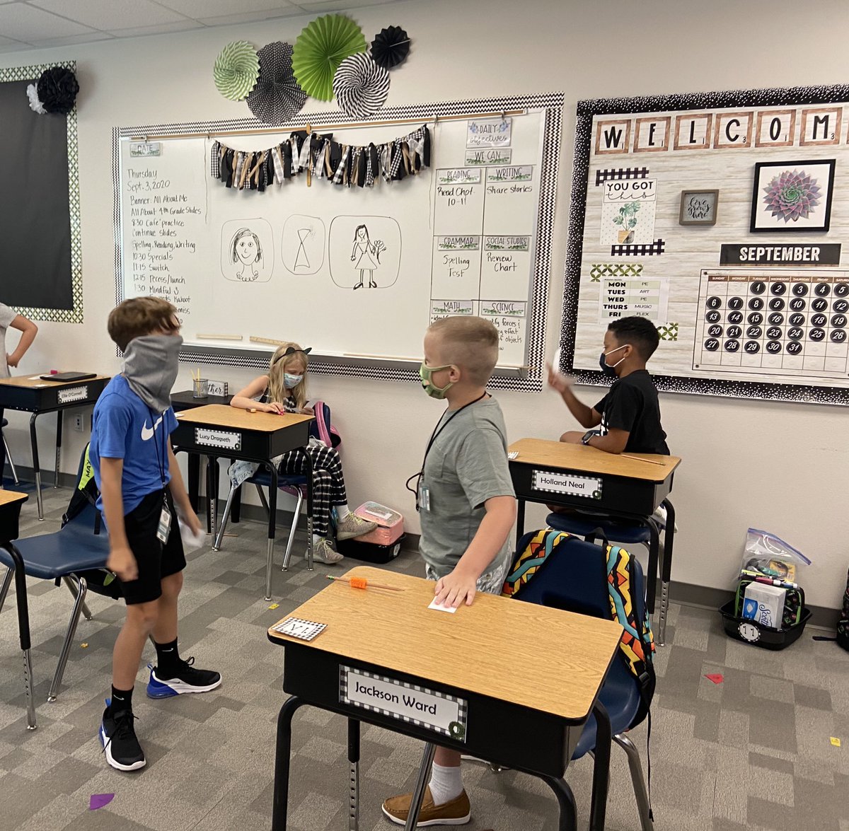 angelaatkagan's tweet photo. First day of in person school success! The desk may have been apart, but my class definitely worked together today! We quizzed our partners before our spelling test today, even with masks on. I am so excited to be their teacher. #mrspink4thgrade @KaganOnline #shoulderpartners https://t.co/CUN3ZYlJ5O