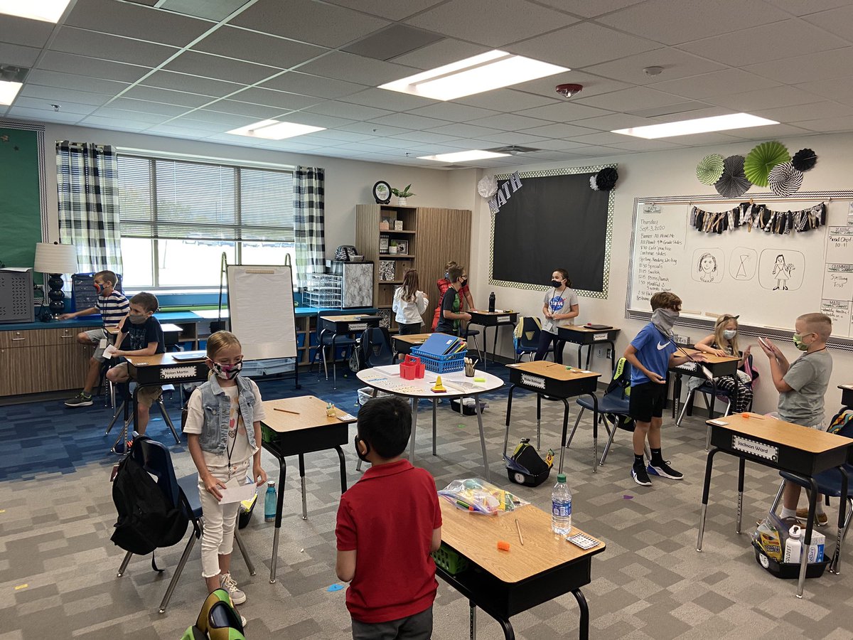 angelaatkagan's tweet photo. First day of in person school success! The desk may have been apart, but my class definitely worked together today! We quizzed our partners before our spelling test today, even with masks on. I am so excited to be their teacher. #mrspink4thgrade @KaganOnline #shoulderpartners https://t.co/CUN3ZYlJ5O