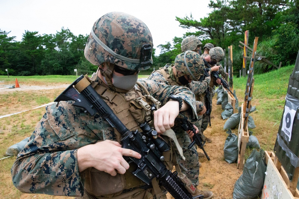 USPACOM's tweet photo. U.S. @PacificMarines with Truck Company, Headquarters Battalion, #3MARDIV, fire an #M4 service rifle during a close-quarters range on Camp Schwab, Okinawa, Japan. #SemperFi #Lethality #FreeandOpenIndoPacific. https://t.co/EHZY2MKcBy