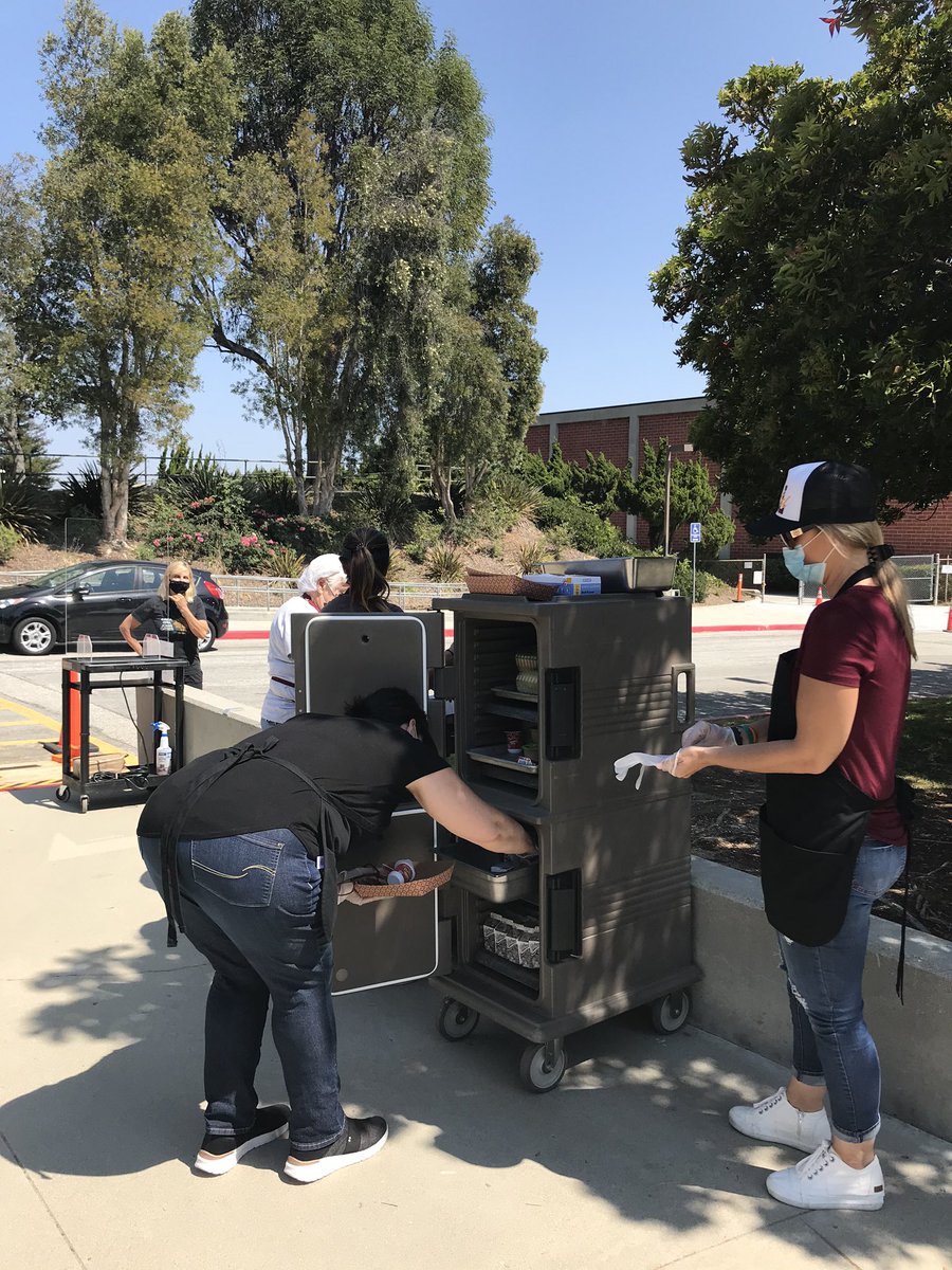 cmpinel's tweet photo. Miraleste cafeteria staff serving up meals for drive-up service for PVPUSD students . ❤️💛 https://t.co/XQkii0UySf
