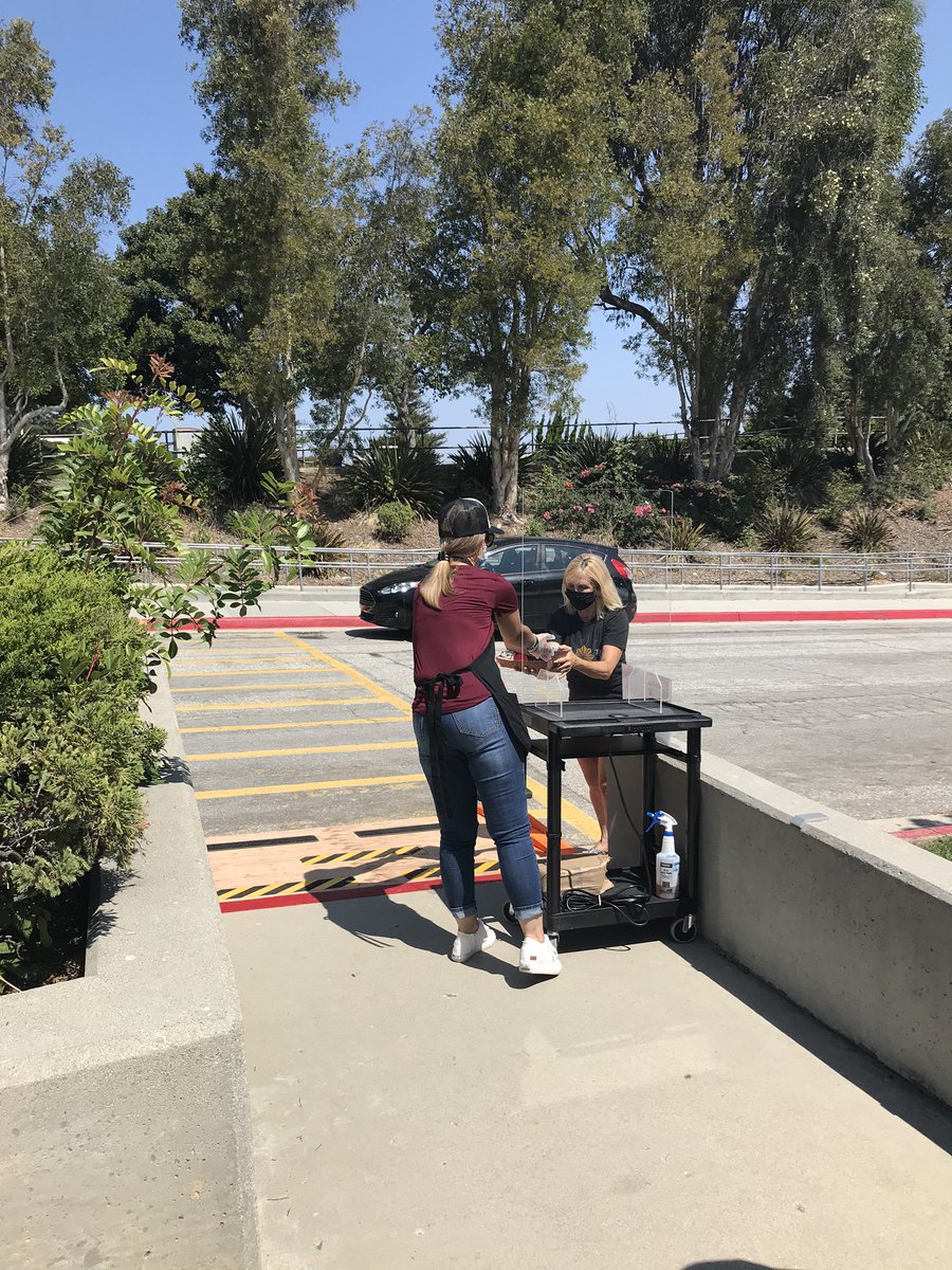 cmpinel's tweet photo. Miraleste cafeteria staff serving up meals for drive-up service for PVPUSD students . ❤️💛 https://t.co/XQkii0UySf