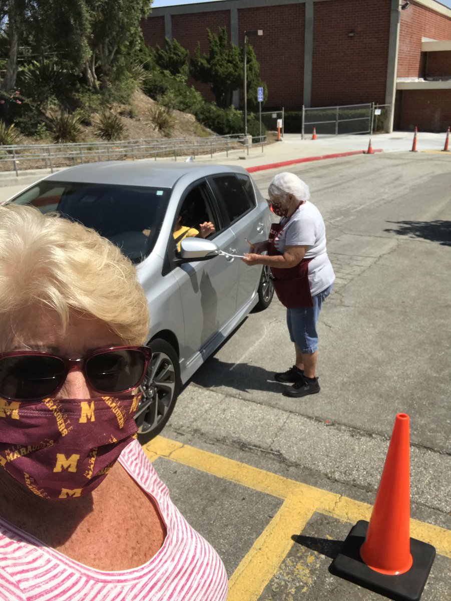 cmpinel's tweet photo. Miraleste cafeteria staff serving up meals for drive-up service for PVPUSD students . ❤️💛 https://t.co/XQkii0UySf