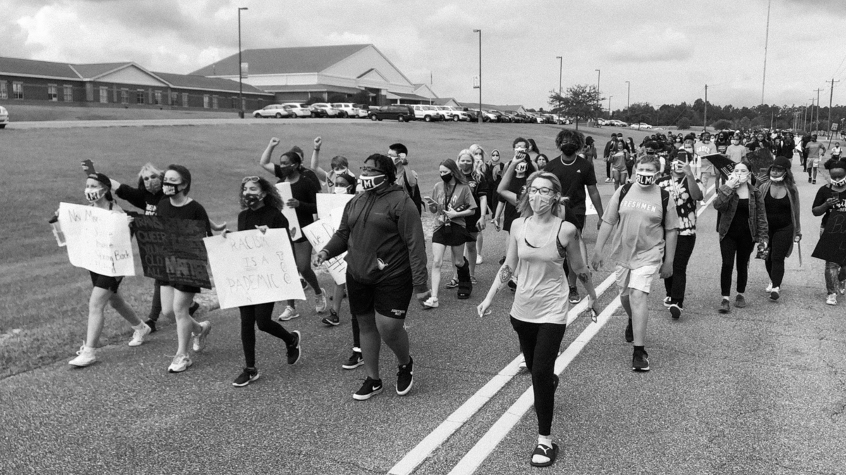 Students walked out, saying officials failed to punish a senior who shouted "White power!" at an event where they say others ran with "TRUMP" & "Blue Lives Matter Flags."Officials are already punishing students who walked out to protest racism, though.  https://www.mississippifreepress.org/5625/good-trouble-in-a-white-flight-suburb-oak-grove-high-kids-confront-racism/