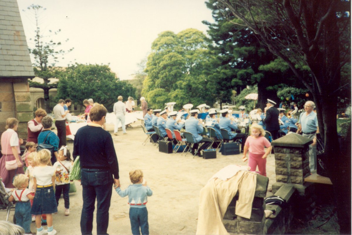 Here's another photo dated to 1987, this time with the Steelworks brass band playing underneath the pine, at the church fete. (The notes in the photo file say '125th anniversary', although dates don't quite add up; B.Reid)