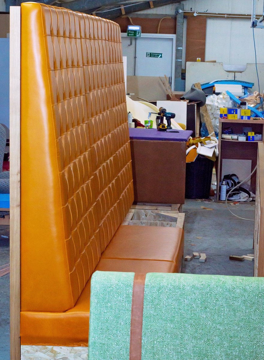 BespokeThis's tweet photo. A work in progress and final shot of some fixed seating for a client #bespokethis #upholstery #fixedseating #workinprogress #orange #deepbuttoned #hospitality #furniture https://t.co/UDVPVydEt6