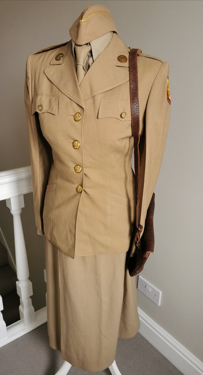 WomenAtWar2's tweet photo. From my #collection, #WAC #summerservice tropical worsted khaki #uniform 1944, replaced stiff, heavier cotton twill. I added #portofembarkation patch for a #livinghistory impression. Jacket named to Iona M. Newell from Iowa, enlisted Feb 45 #womenatwar #WWII #USArmy #militaria https://t.co/NtEIQ39pDq