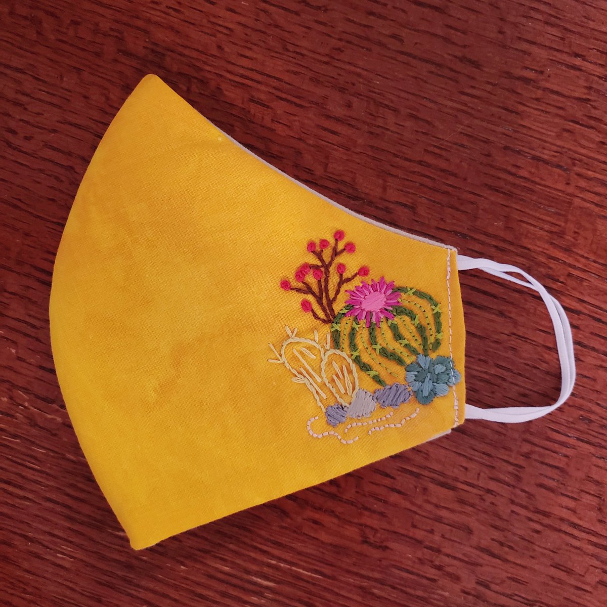 I put a twist on the <a href="/mathgrrl/">mathgrrl</a> mask and added embroidery.  She has a great artice/tutorial on how to make them and their efficacy on her website.  I think all my masks will be fancy now.