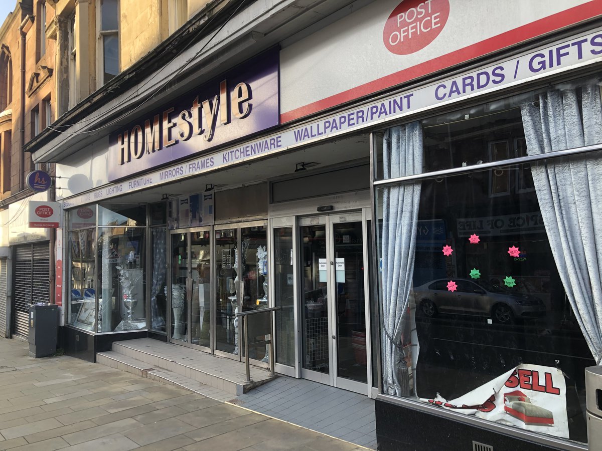 Wishaw is a place full of wonder, where you can buy beds from the post officeThis advertising is even worse than the “print out individual words onto separate A4 sheets in 144pt Times New Roman” approach that shops usually take when they need low-budget window signage